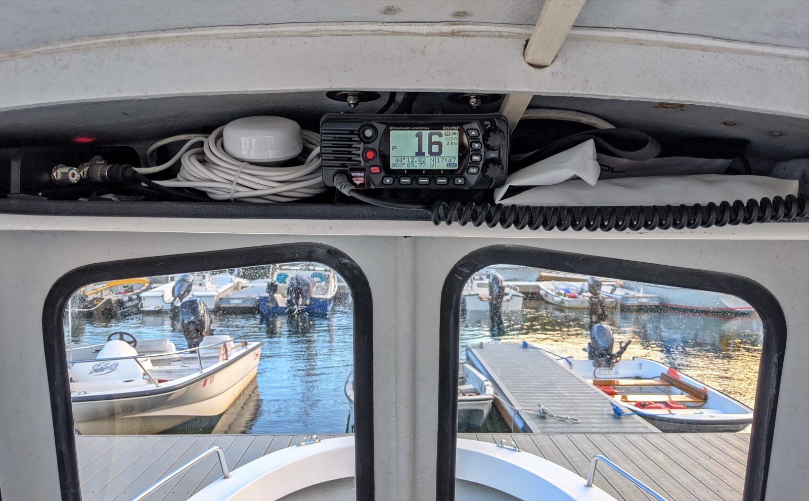 The overhead shelf is stuffed with cables, AIS & VHF for a reason